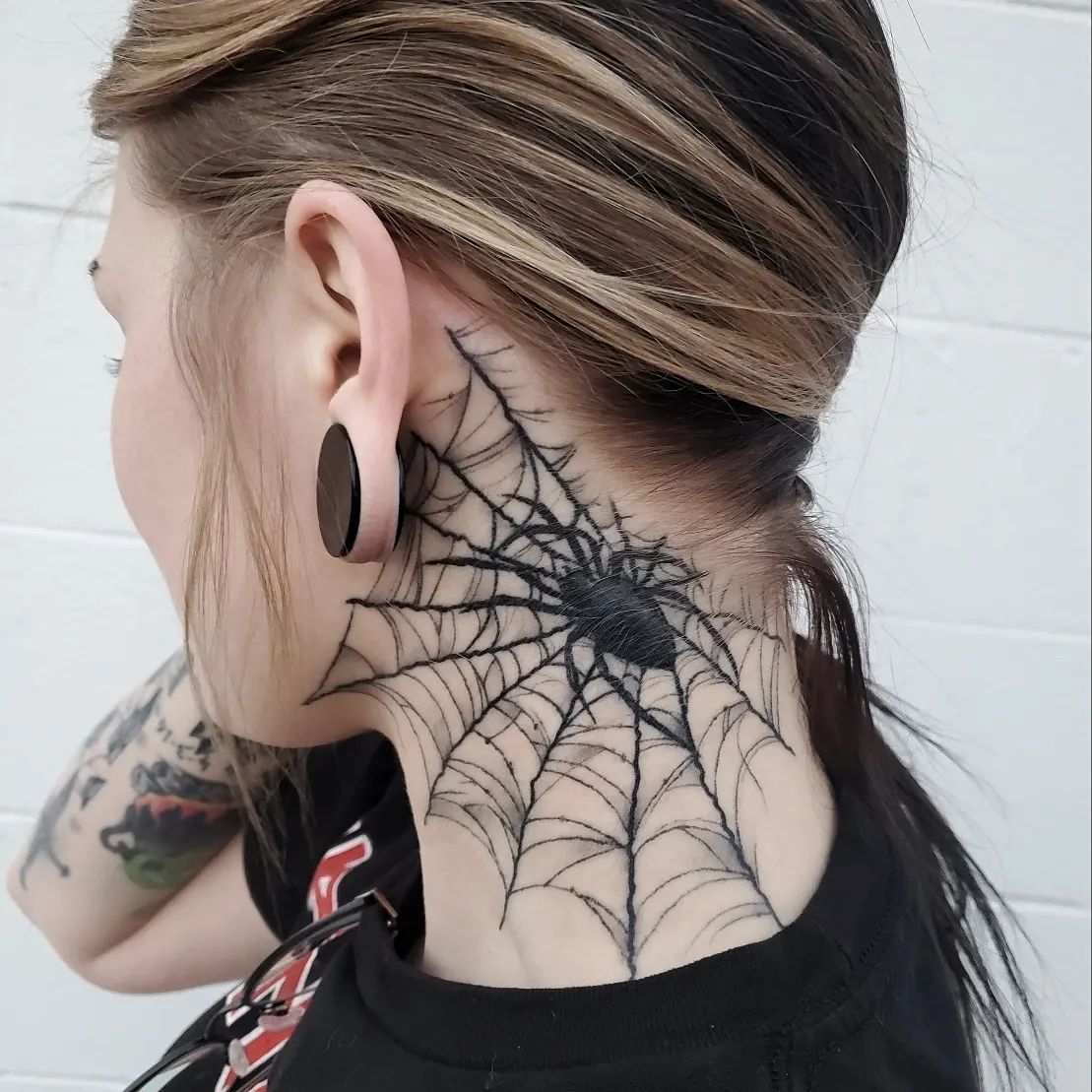 Spider with web tattoo
